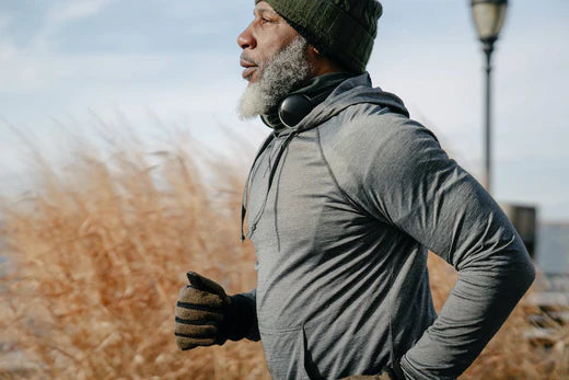 Elderly man engaging in active running exercise for health and fitness